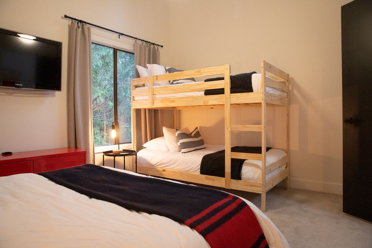 Bedroom with a bed and twin bunk beds