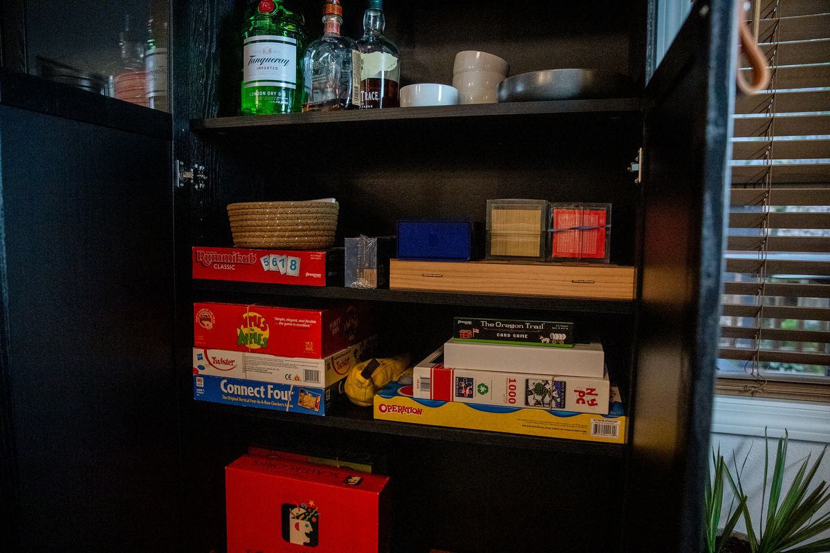 Cabinet stocked with board games